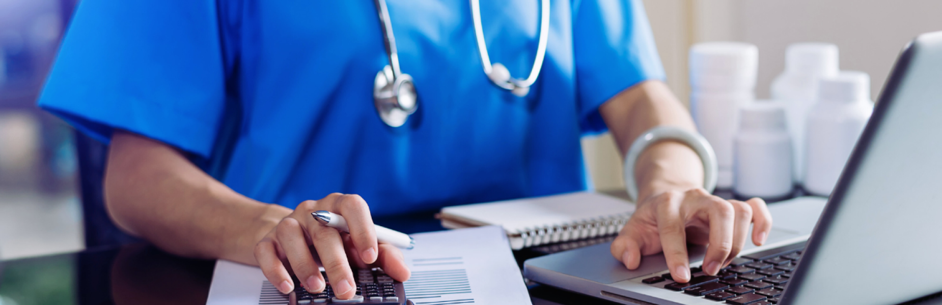 healthcare worker using laptop