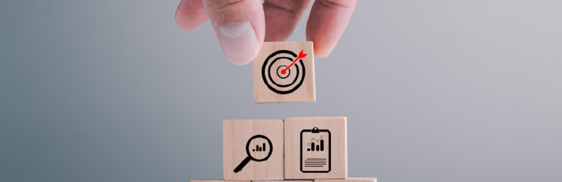 Hand stacking square wooden planning icons