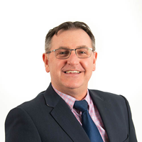 Headshot photograph of Anthony Veale