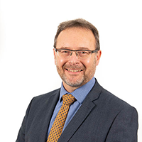 Headshot photograph of Dave Thomas